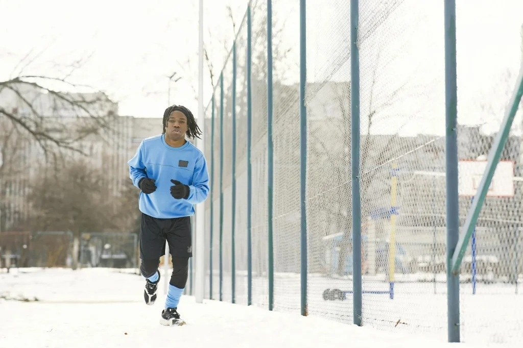 Runner on a cold winter morning showing breath in the air