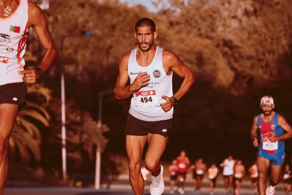 Runner checking GPS watch on wrist during marathon training