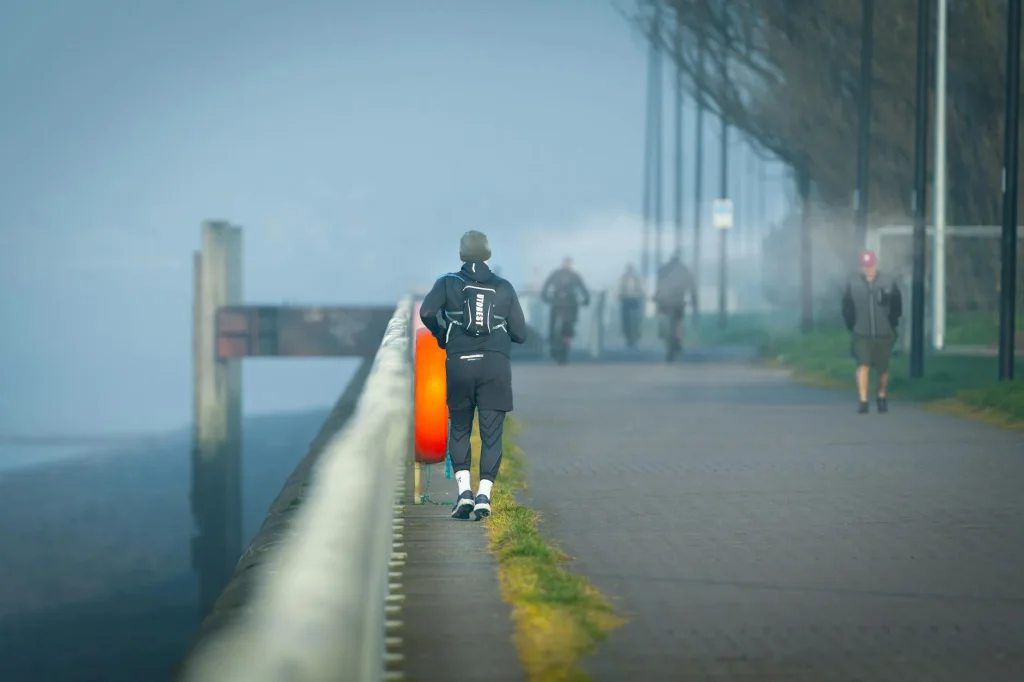 Runner in layered clothing on a cold winter morning