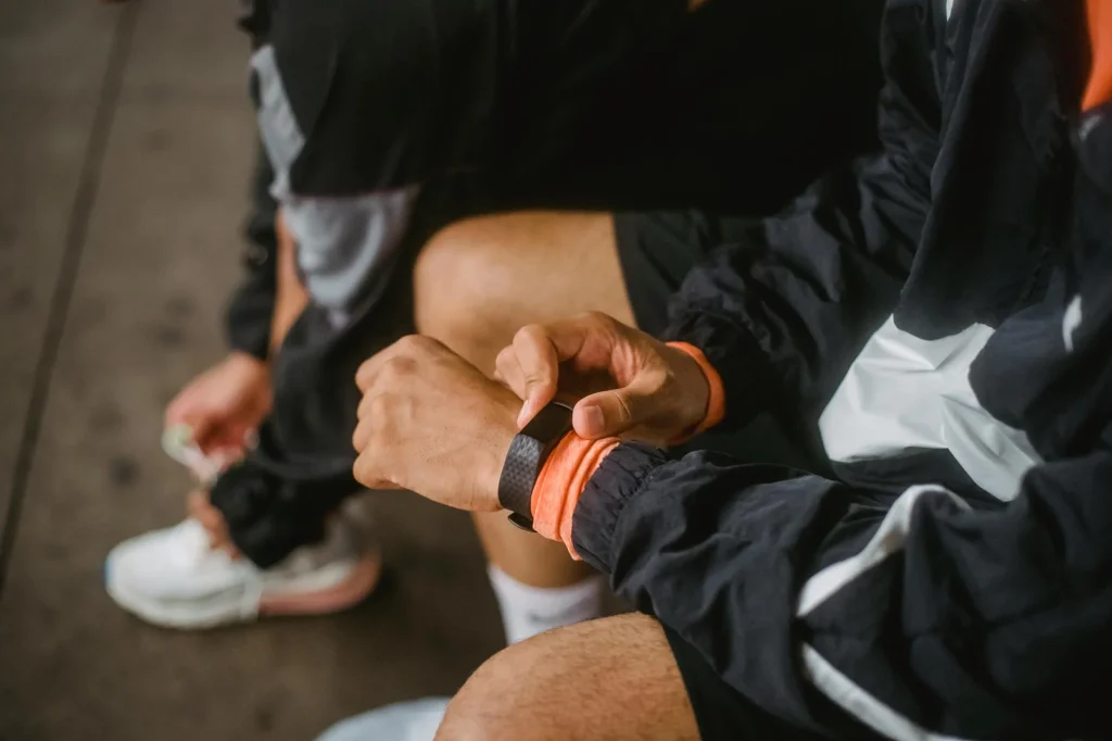 GPS running watch on a wrist showing interval workout data