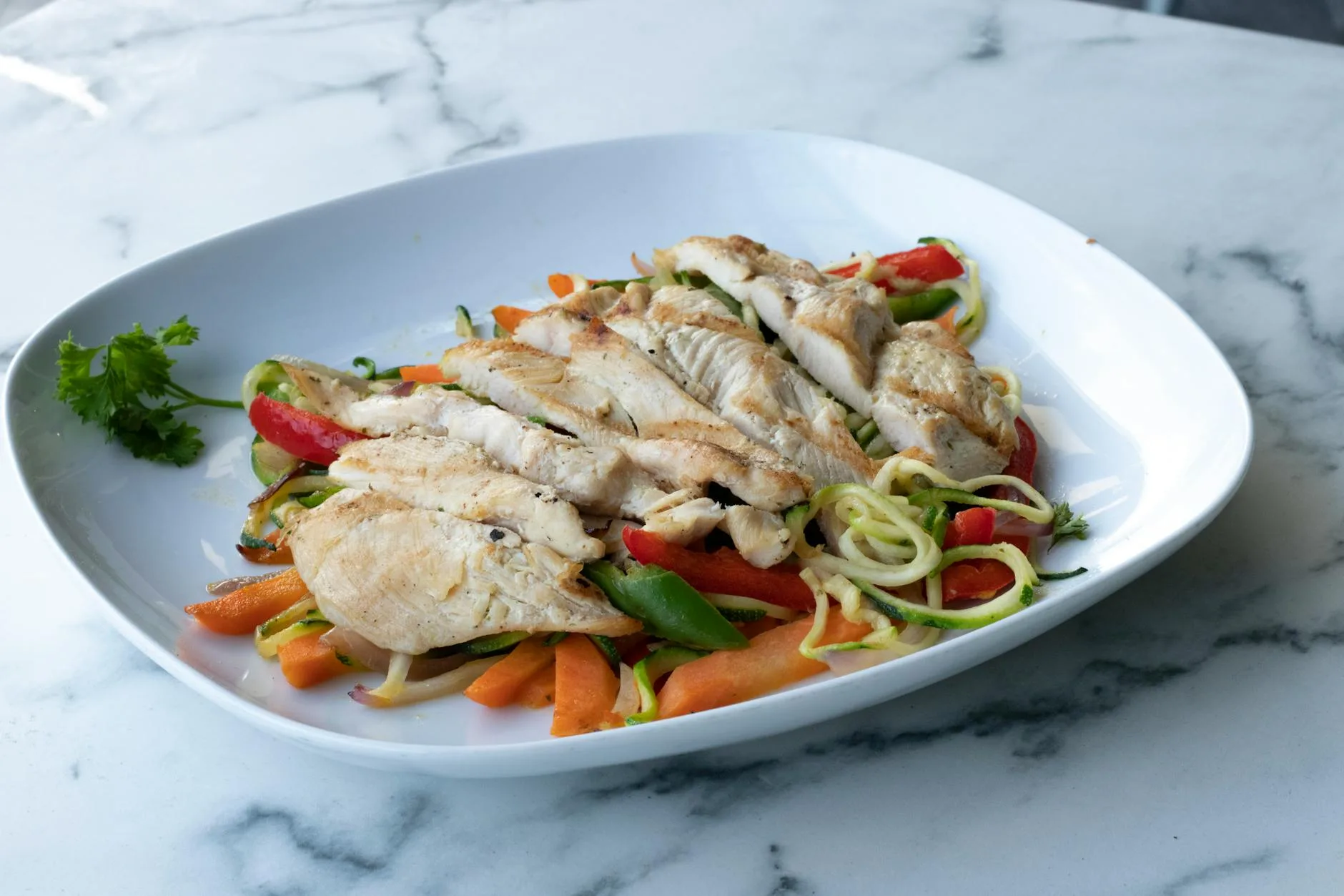 Grilled chicken breast with vegetables on a plate