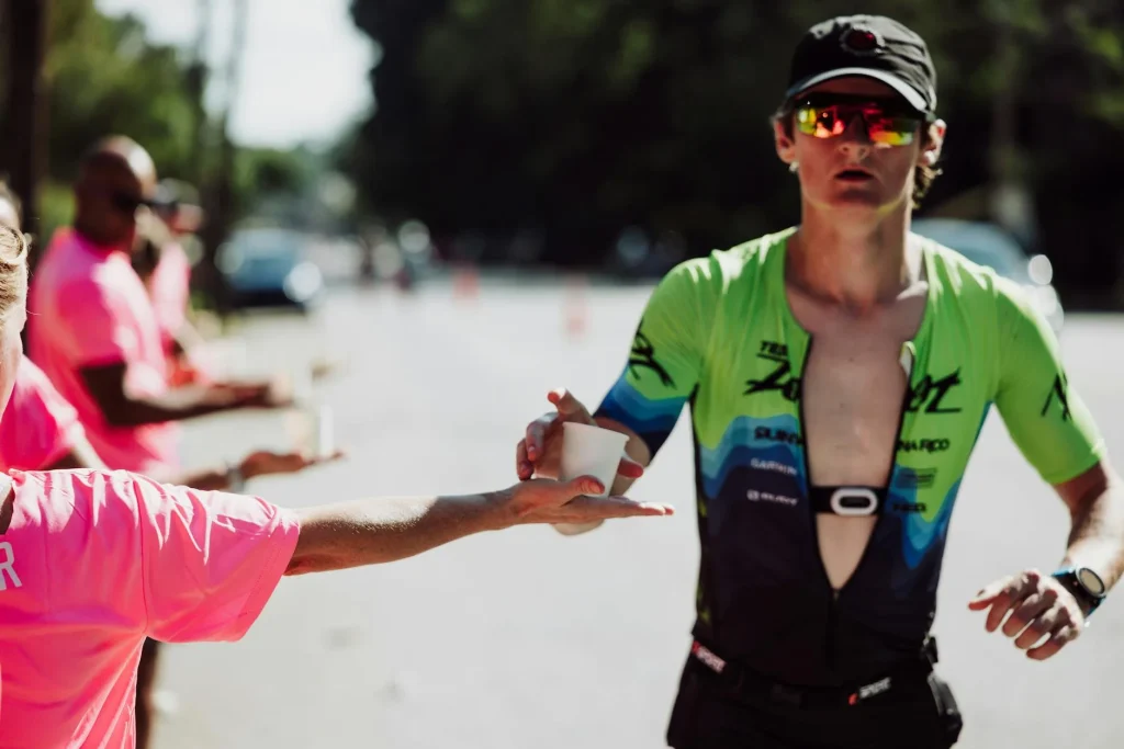 Marathon runner taking an energy gel during a race