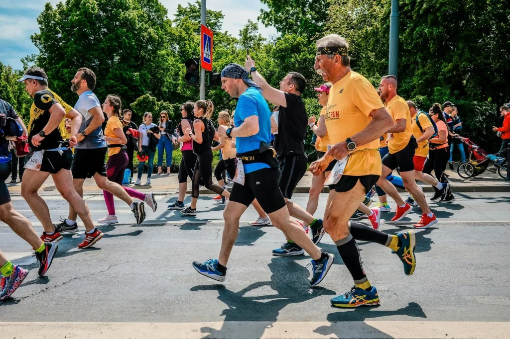 Marathon runners during a road race event with crowd support