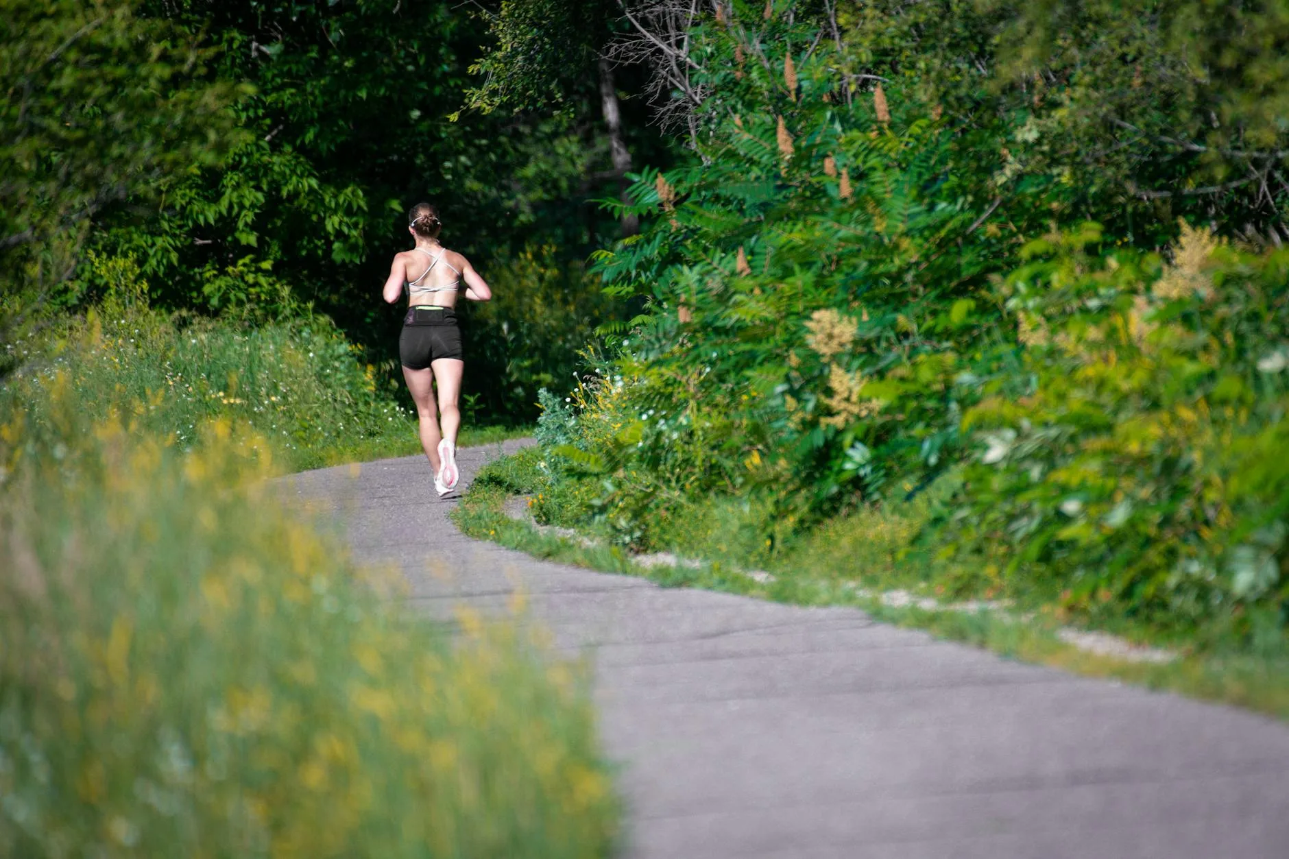 Runners feet on a trail path during an outdoor run