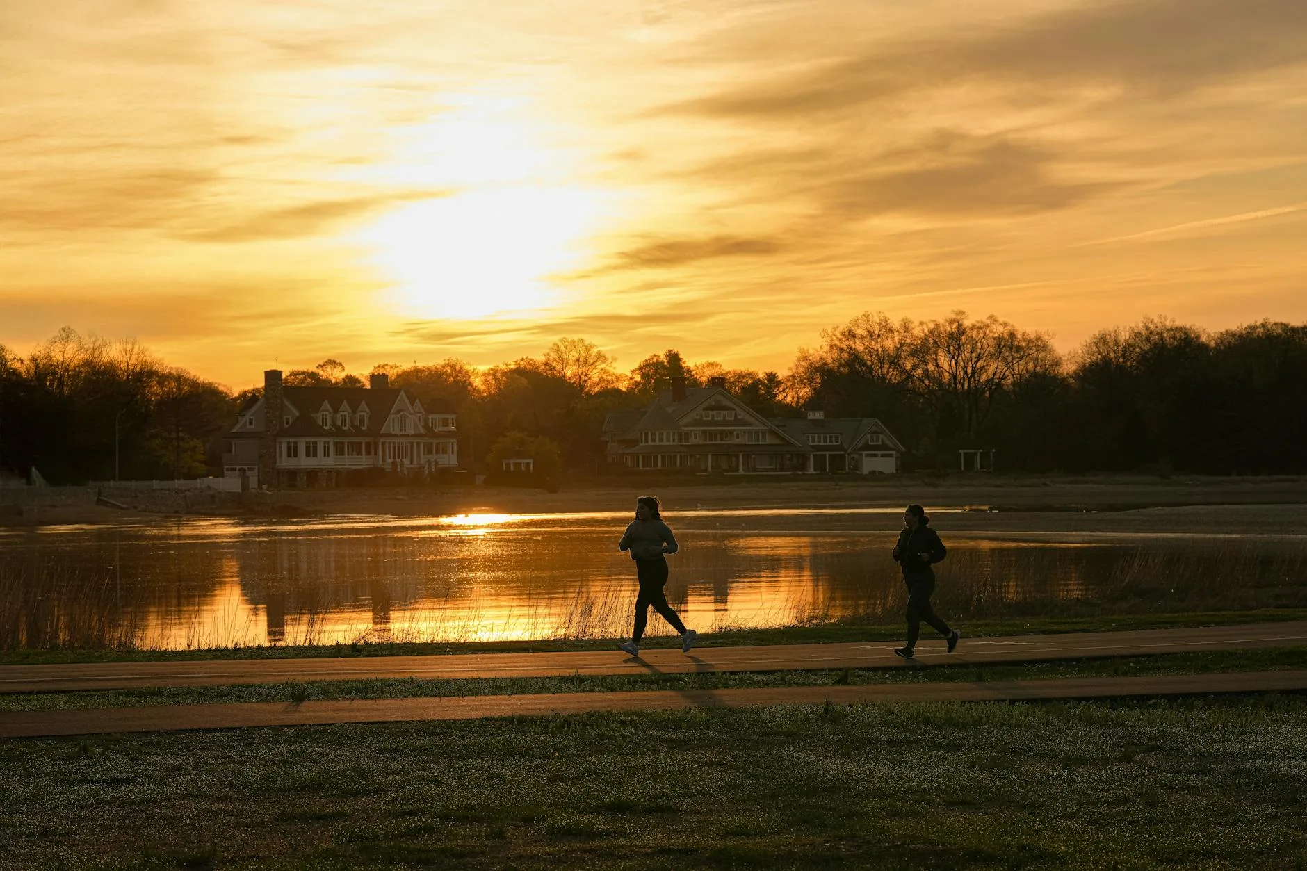 Runner on an outdoor trail at sunrise
