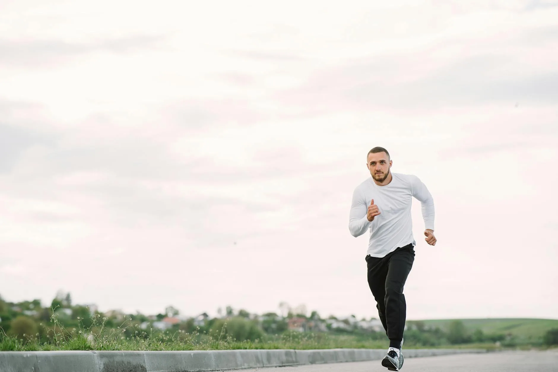 Runner training on a road during a morning sunrise run