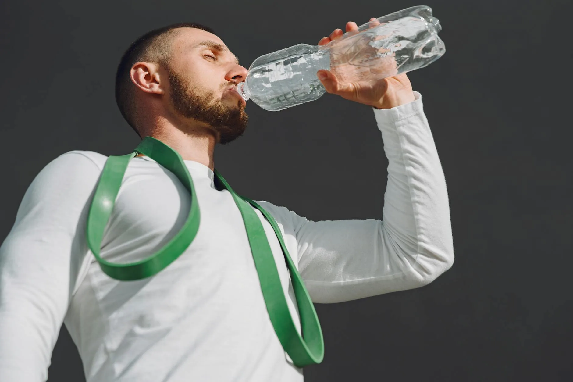 Runner holding a water bottle for hydration