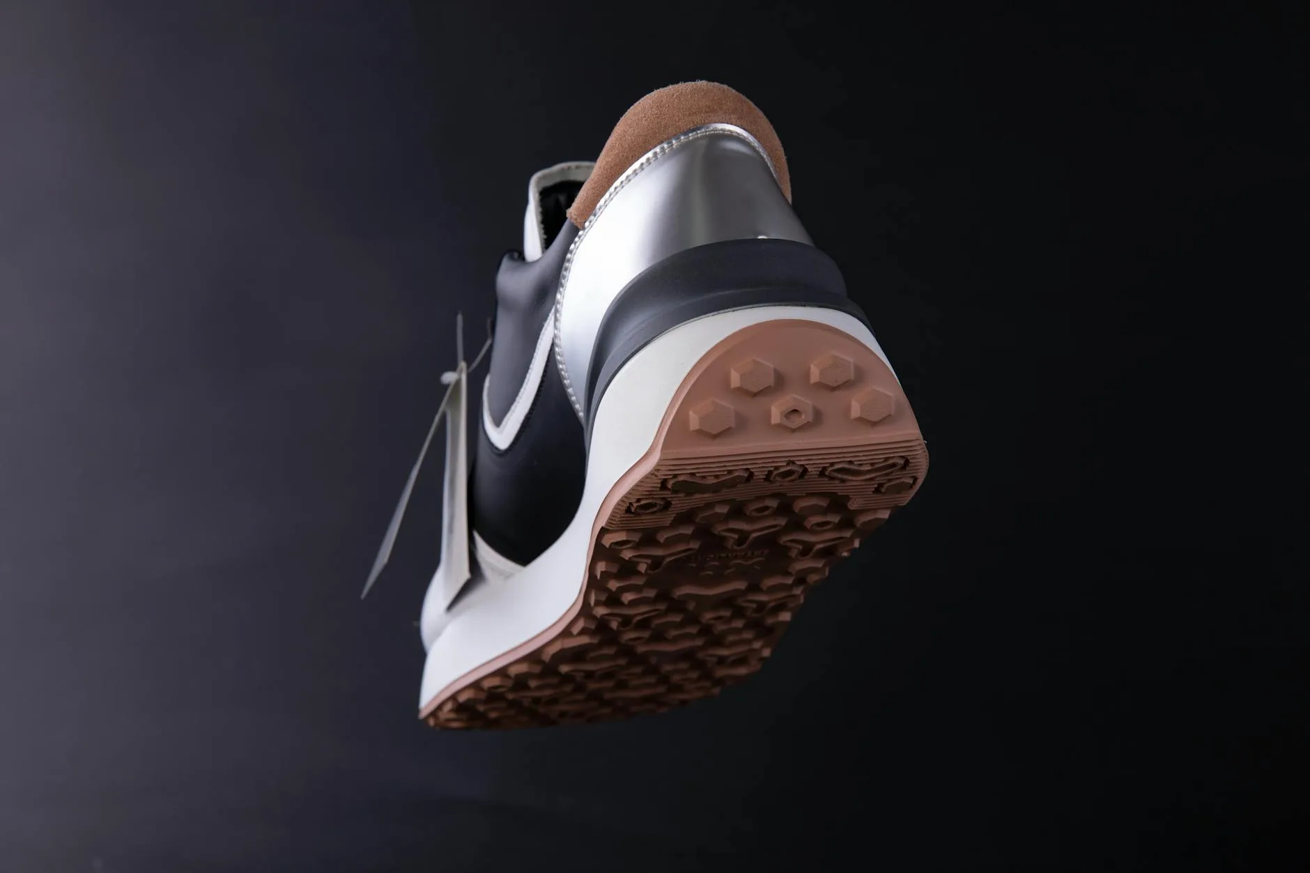 Close-up of a running shoe sole showing tread pattern