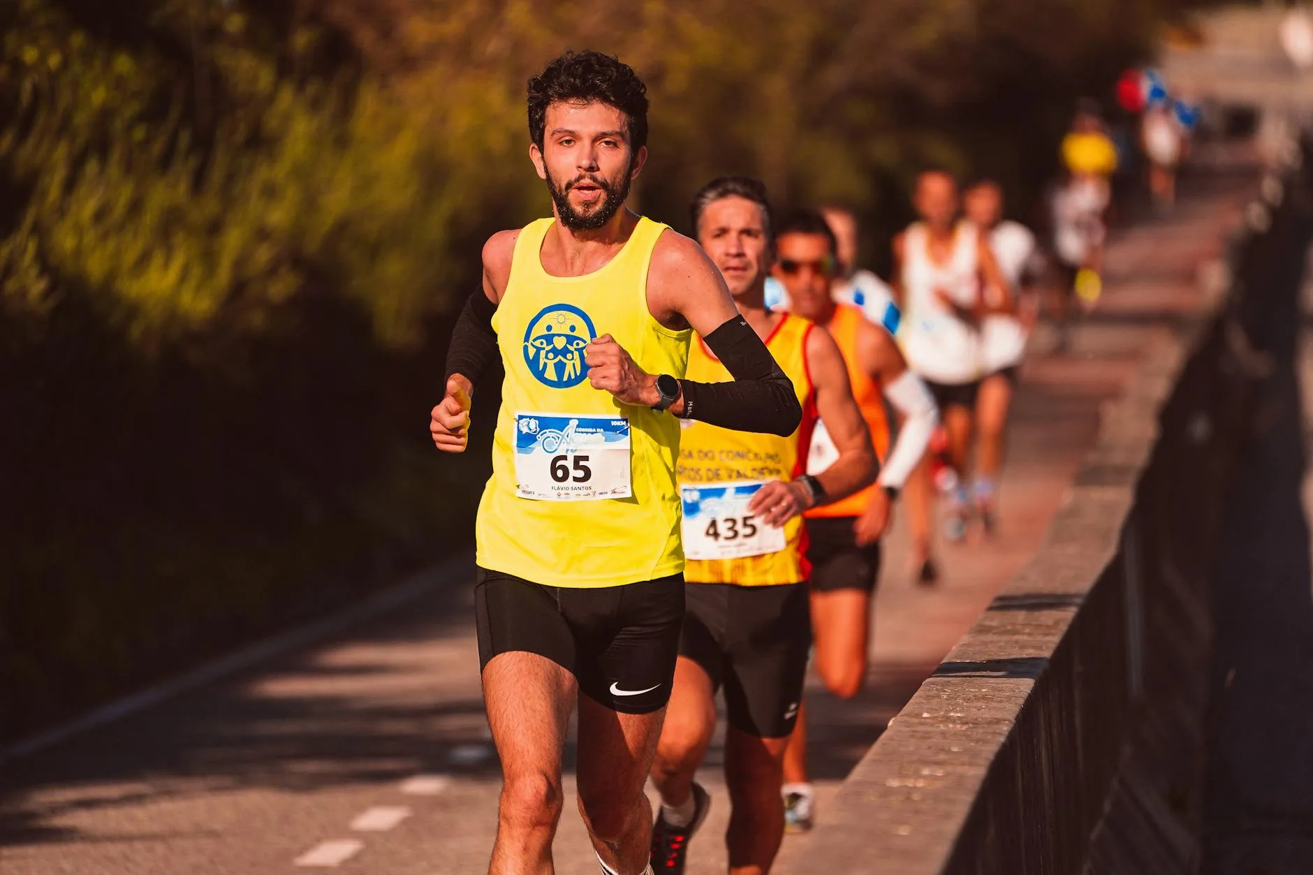 Runners competing in a road race where hydration is essential