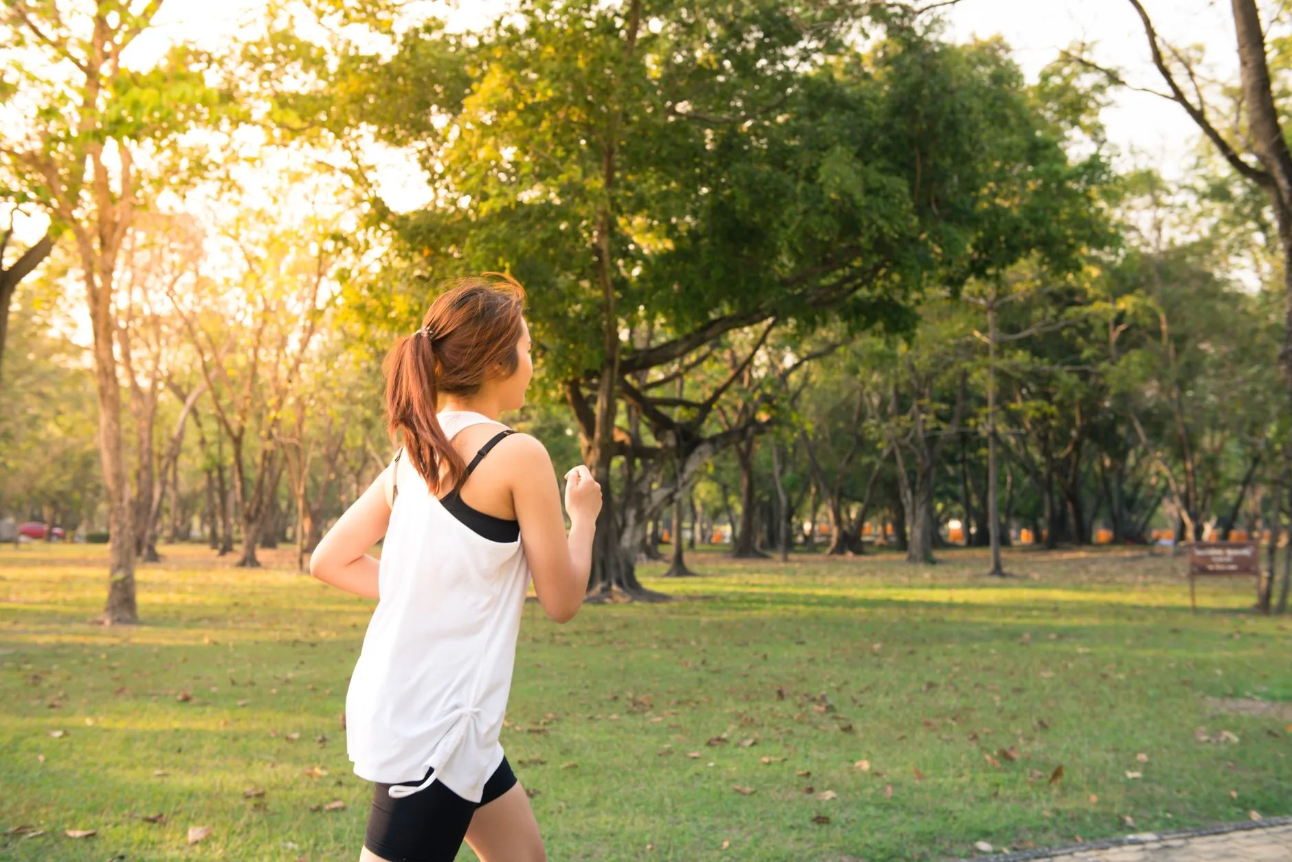 Runner training at an easy pace in a park