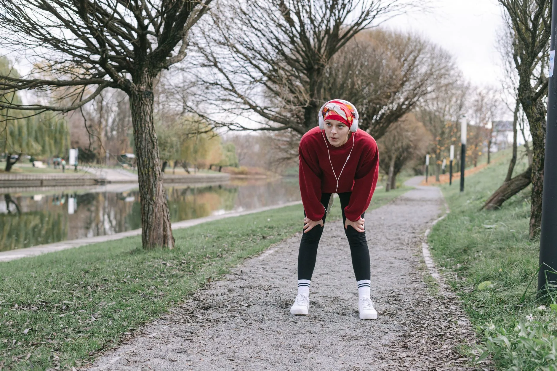Runner taking an easy walk break on a park path