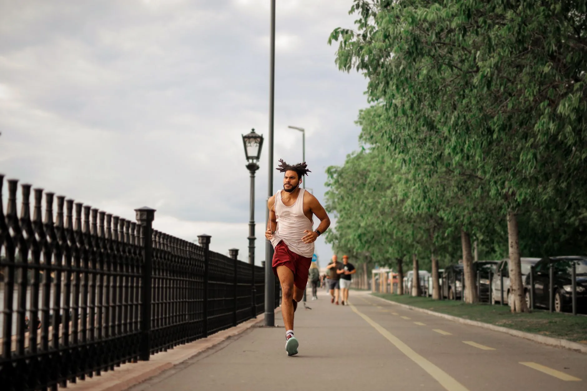 Runner training outdoors on a park path