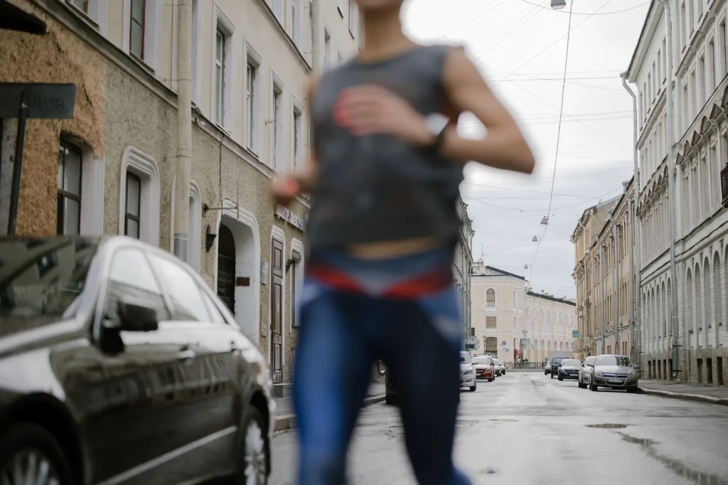 Runner holding a steady pace while practising breathing