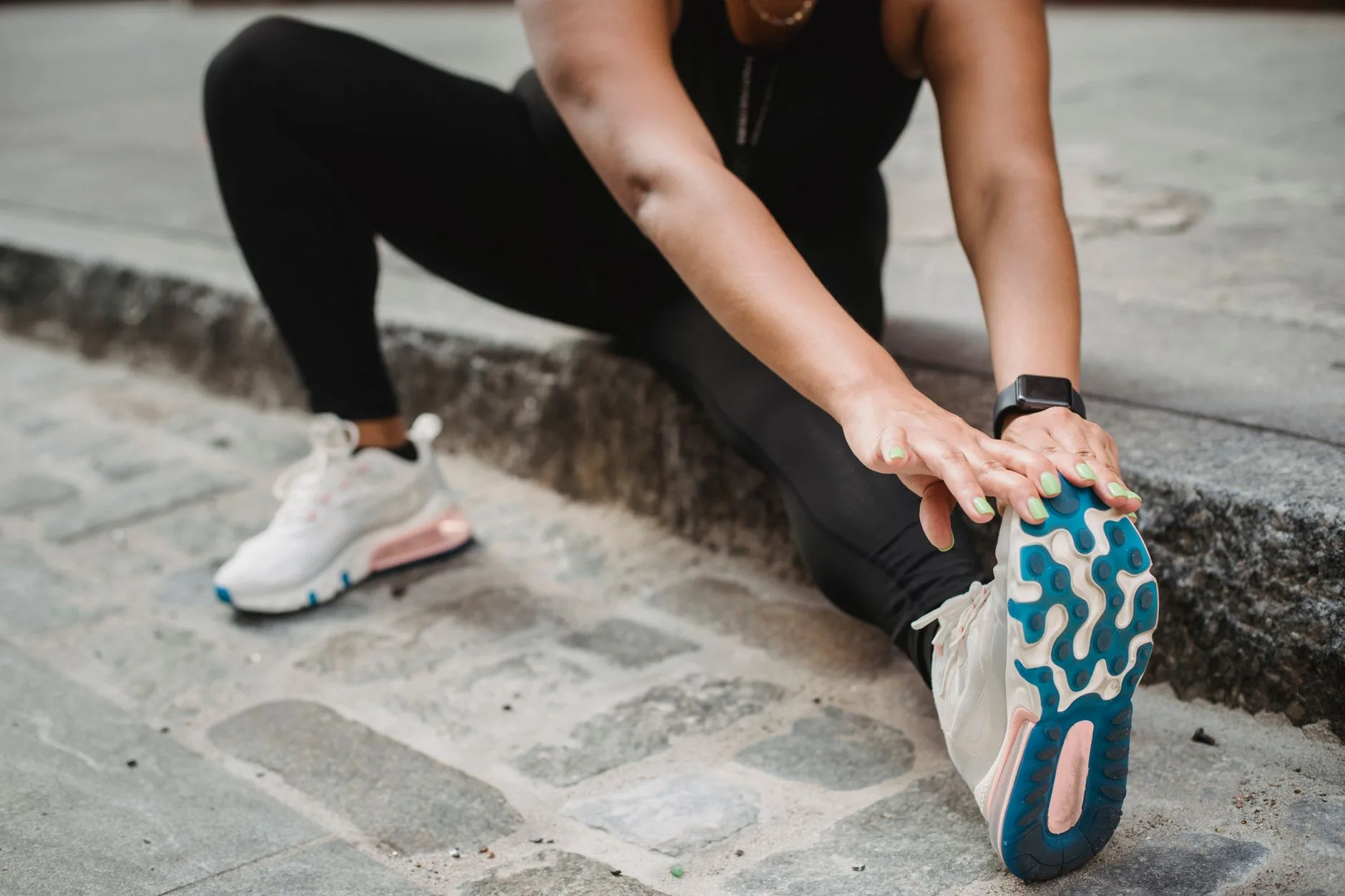 Runner stretching calf muscles after an easy run