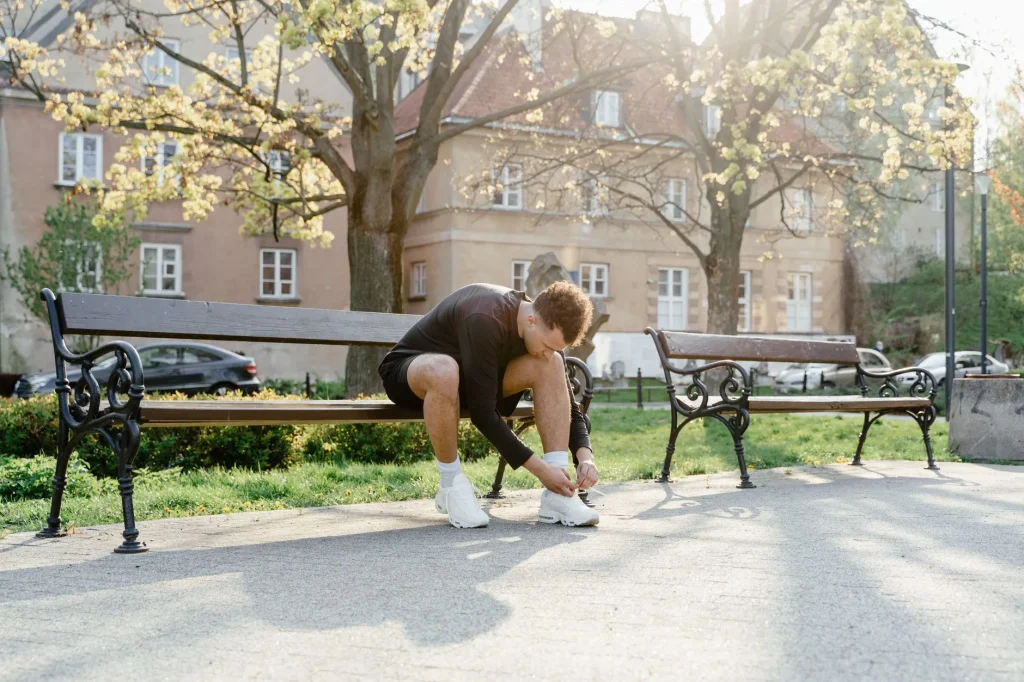 Runner wearing shorts on a park path