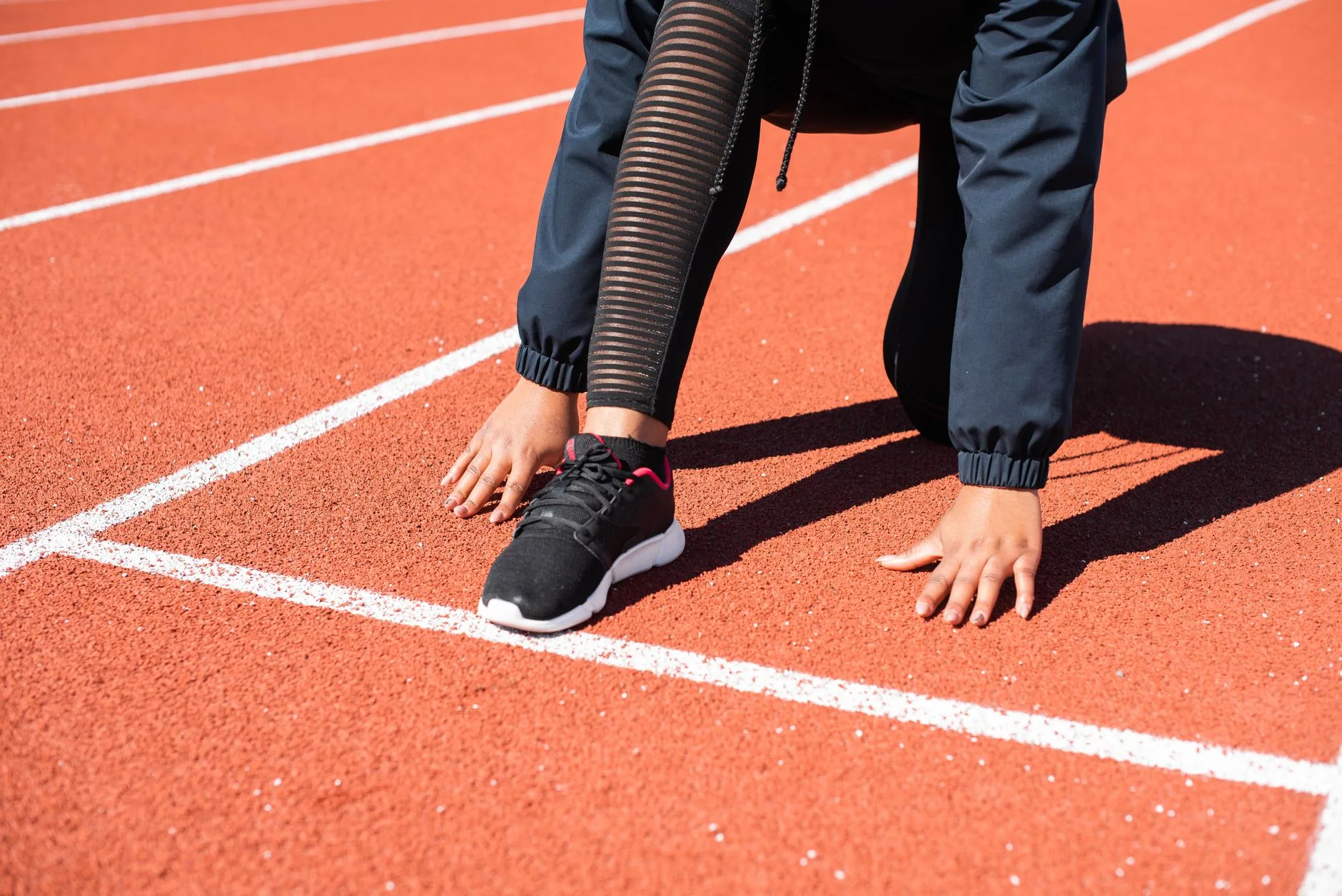 Runner shoes on a track before cadence drill practice