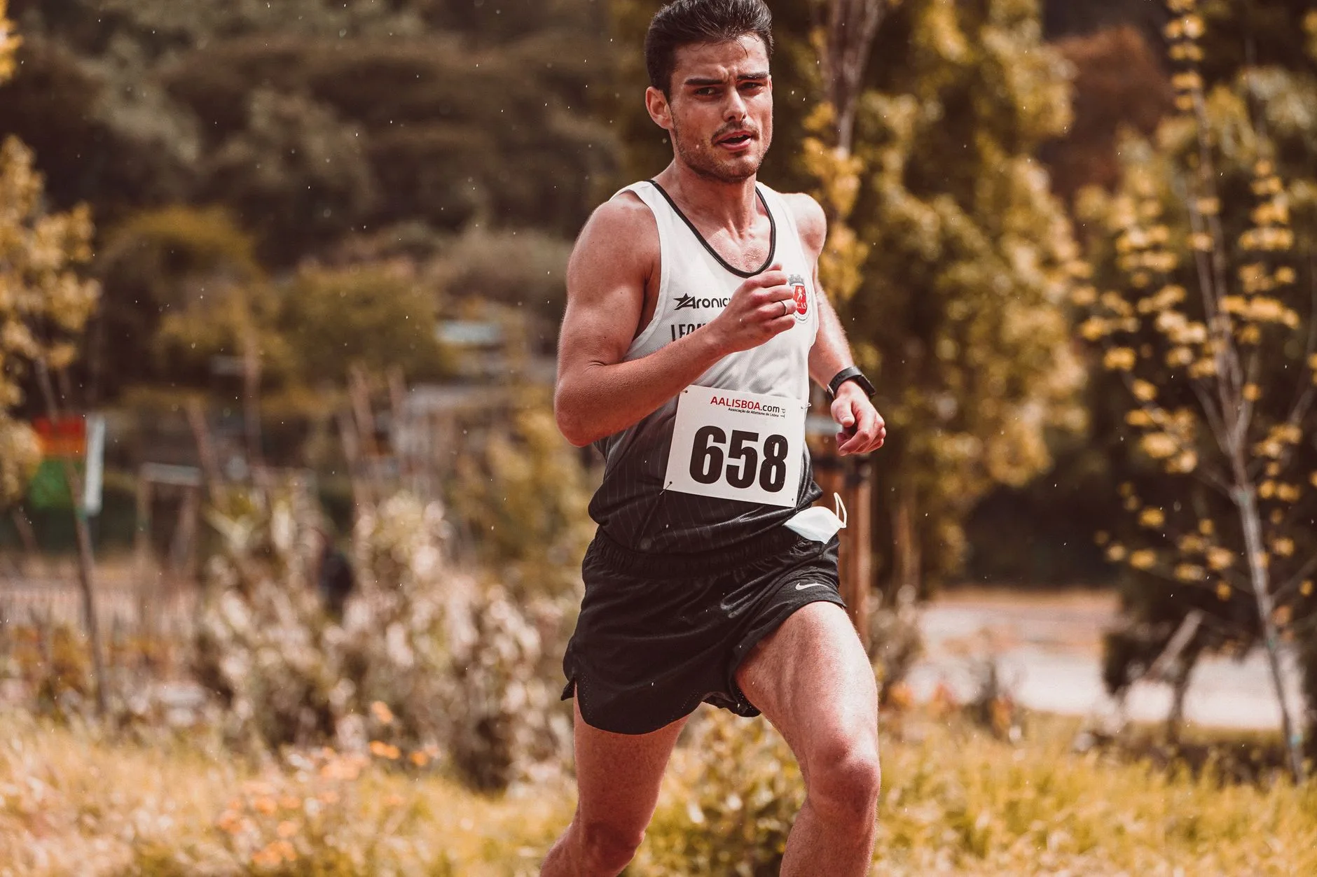 Runner doing interval training on an athletics track