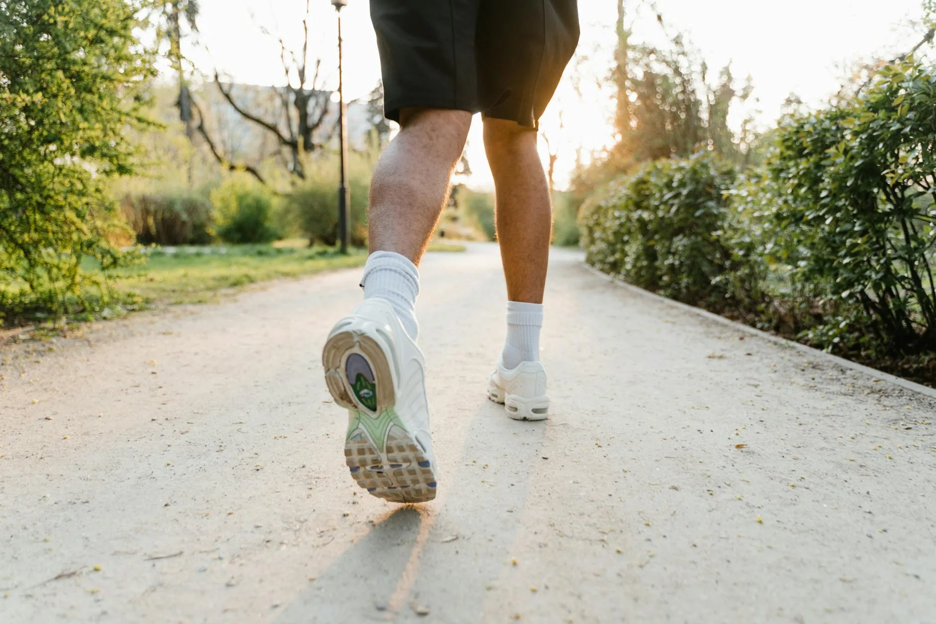 Runner in shorts on a road run