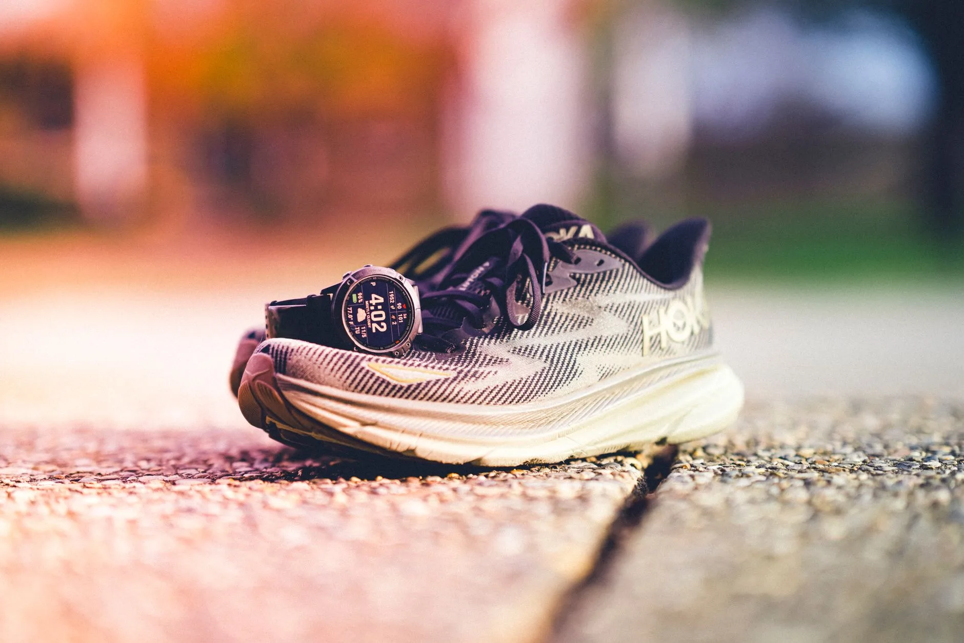 Running shoes, GPS watch and training log ready for review