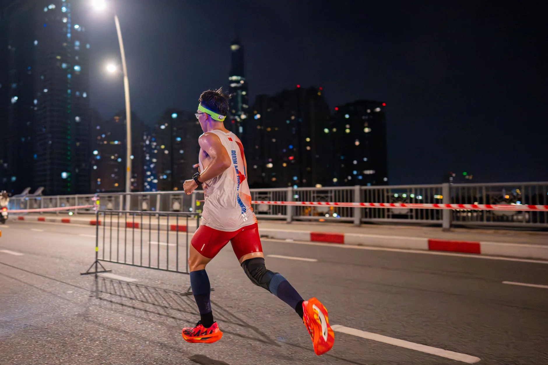 Runner wearing a headlamp while training outdoors after dark